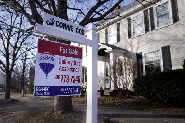 FILE - A sign announcing a house for sale is posted outside a single family home, Tuesday, Feb. 7, 2023, in Exeter, N.H. Several housing economists are projecting that mortgage rates will ease moderately next year, though the forecasts call for the average rate on a 30-year home loan to remain above 6%. While lower rates could help bring more buyers off the sidelines, the projected declines are unlikely to encourage homeowners who locked in rock-bottom rates two years ago to sell. (AP Photo/Charles Krupa, File)