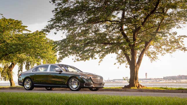 A photo of a beige and green Mercedes-Maybach S680 sedan. 