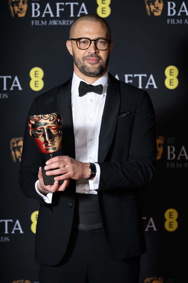 Cord Jefferson poses with the Adapted Screenplay Award in the Winners Room during the EE BAFTA Film Awards 2024 at The Royal Festival Hall on February 18, 2024 in London, England.