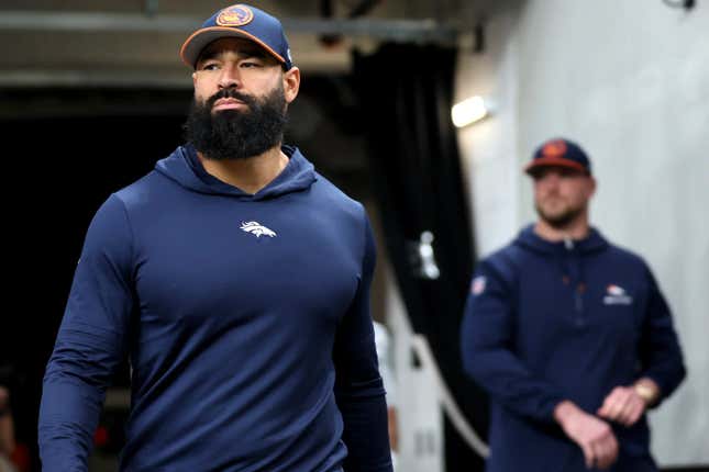 Denver Broncos outside linebackers coach Michael Wilhoite takes the field before an NFL football game against the Las Vegas Raiders, Jan. 7, 2024, in Las Vegas