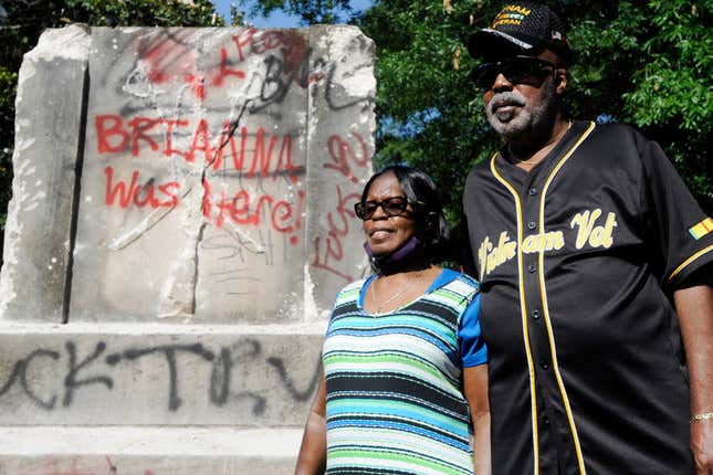 Sarah Collins Rudolph, who survived a racist church bombing that killed sister Addie Mae Collins and three other girls in 1963, stands with husband George Rudolph at the remains of a Confederate memorial that was removed in Birmingham, Ala., on Tuesday, June 2, 2020. The city took down the more than 50-foot-tall obelisk following protests over the police death of George Floyd and a night of vandalism in the city. 