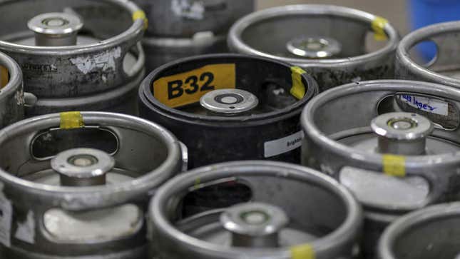 A photo of a stack of beer kegs at a brewery. 