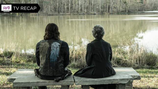 Daryl and Carol sit on a stone bench overlooking a small, placid lake.