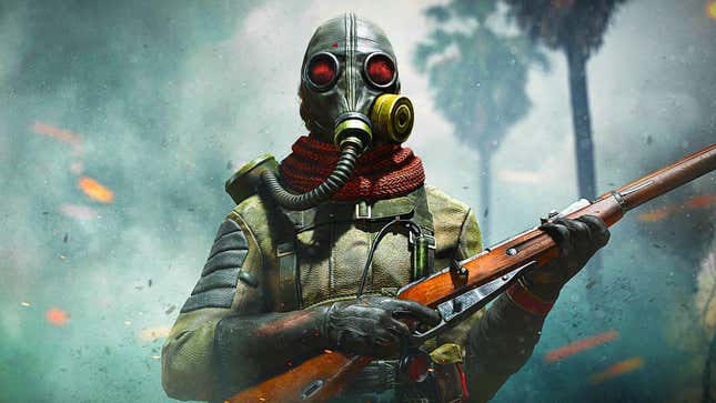 A soldier wearing a gas mask stands in a cloud of smoke while holding a rifle. 