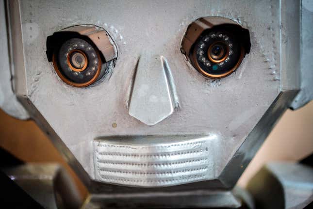 Its ‘eyes’ made out of small cameras, its head a dusty collection of bonded aluminum plates, one of Congo’s humanioid robot traffic police sits in a Kinshasa workshop, waiting to be finished and deployed on the streets.