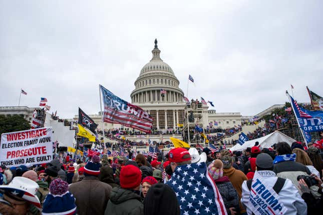 Rioters loyal to President Donald Trump rally at the U.S. Capitol in Washington on Jan. 6, 2021. A North Carolina man has become the second member of the Proud Boys to plead guilty to conspiring with other members of the extremist group to stop Congress from certifying the Electoral College vote. Charles Donohoe pleaded guilty Friday to charges of conspiracy and assaulting federal officers during an appearance in federal court in Washington.