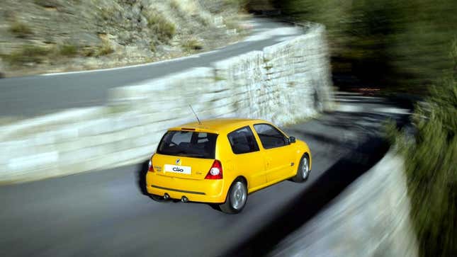 A photo of a yellow Renault Clio RS hatchback. 