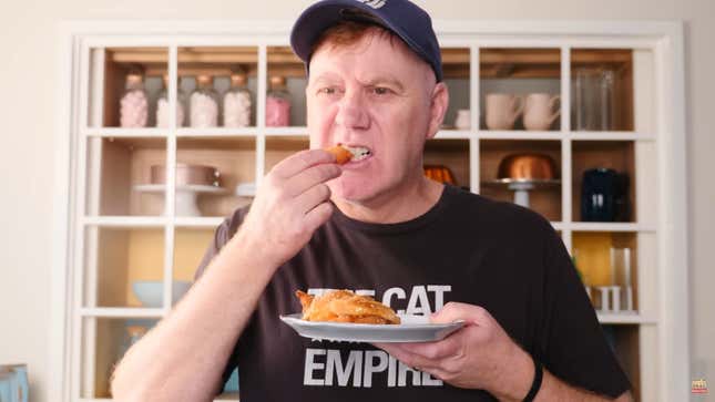 Dave, Ann's husband, trying an orange honey churros, and not looking pleased.