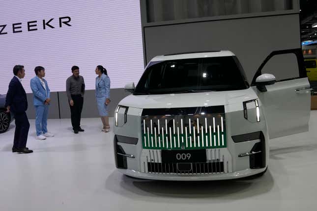 Visitors look at ZEEKR&#39;s electric vehicles &quot;009&quot; during the 45th Bangkok Motor Show in Nonthaburi, Thailand, Tuesday, March 26, 2024. (AP Photo/Sakchai Lalit)