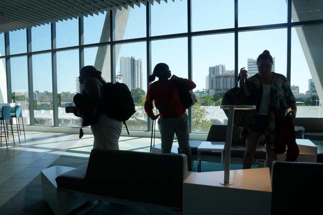 Passengers gather their belongings to board a train from the Fort Lauderdale station, Friday, Sept. 8, 2023, in Fort Lauderdale, Fla. Brightline, which began running its neon-yellow trains between Miami and West Palm Beach in 2018, is the first private intercity passenger service to begin U.S. operations in a century. It&#39;s also building a line connecting Southern California and Las Vegas that it hopes to open in 2027. (AP Photo/Marta Lavandier).