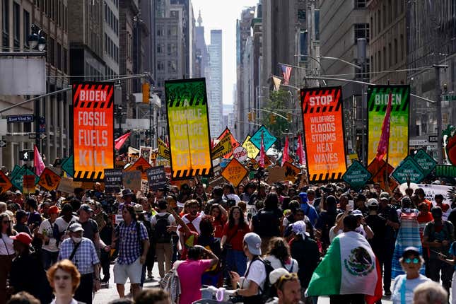 FILE - Climate activists march on Madison Avenue while protesting energy policy and the use of fossil fuels, in New York, Sunday, Sept. 17, 2023. Outside the gates of the United Nations, many civil society groups, activists and major philanthropic foundations are making plans on the sidelines of the General Assembly to push forward toward achieving the Sustainable Development Goals. (AP Photo/Bryan Woolston, File)