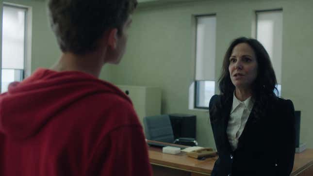 Luke talks to Ms Sigsby in her dreary office.