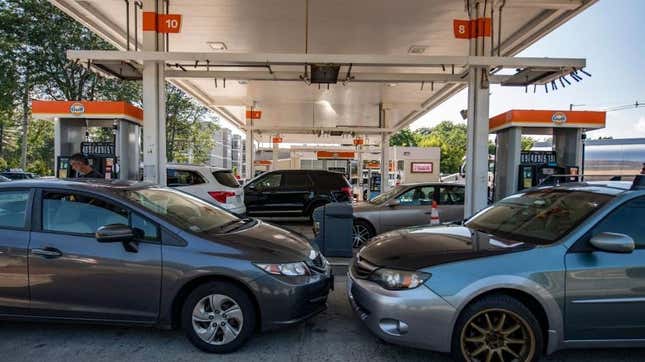 Cars sit at gas pumps in Lynnfield, Massachusetts, on July 19, 2022.