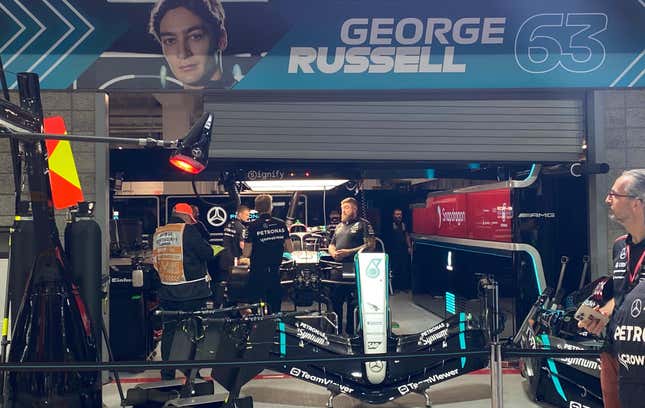 A photo of George Russell's garage with a nose piece propped up in front