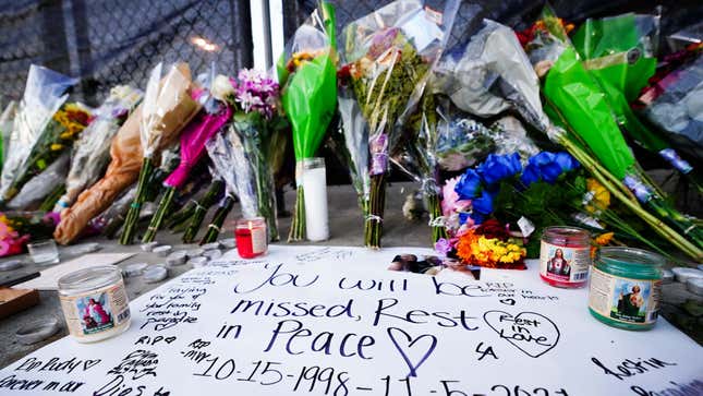 Candles, flowers and letters are placed at a memorial outside of the canceled Astroworld festival at NRG Park on November 7, 2021, in Houston, Texas.