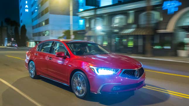 An Acura RLX driving at night. 