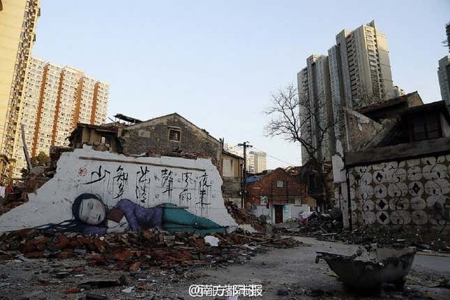 The words on the wall are from a Tang dynasty poem that reads, “Last night l heard a sound of wind and rain. How many blossoms have fallen again.”