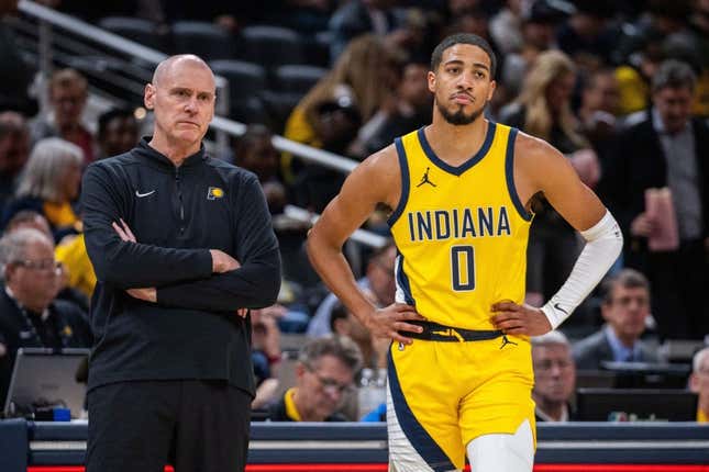 Oct 30, 2023; Indianapolis, Indiana, USA; Indiana Pacers head coach Rick Carlisle and guard Tyrese Haliburton (0) look on in the second half against the Chicago Bulls at Gainbridge Fieldhouse.