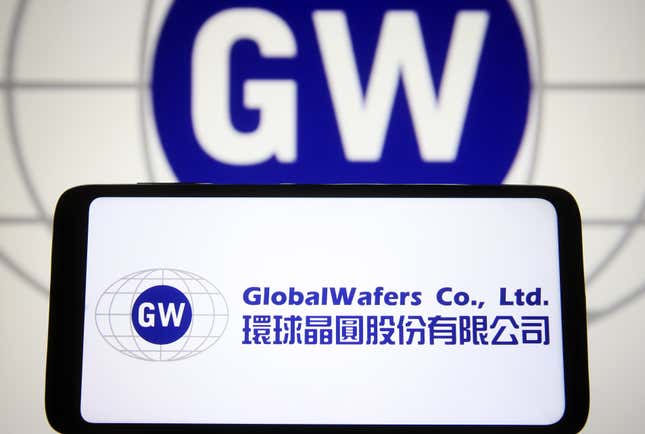 GW logo in the background and GlobalWafers logo is displayed on a smartphone screen in the foreground