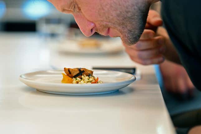 Dave Pirazzini smells cultivate chicken before sampling it at GOOD Meat&#39;s Alameda, Calif., headquarters on Thursday, Sept. 28, 2023. The company&#39;s cultivated chicken, which is grown from animal cells, is approved for sale in the United States and Singapore. (AP Photo/Noah Berger)