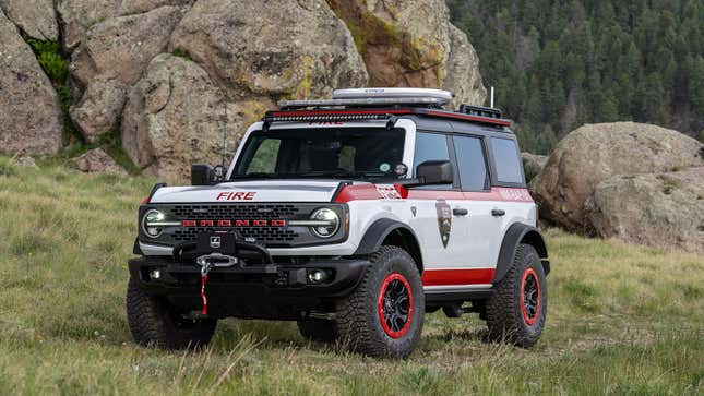 A photo of the red and white Ford Bronco fire truck. 