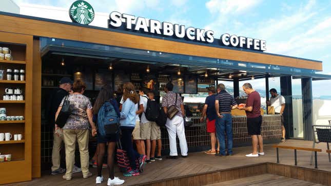 Customer at a Starbucks In Monaco, French Riviera.