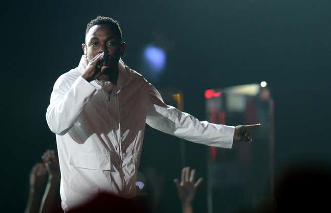 Singer Kendrick Lamar performs together with Imagine Dragons during the 56th Grammy Awards at the Staples Center in Los Angeles, California, January 26, 2014.