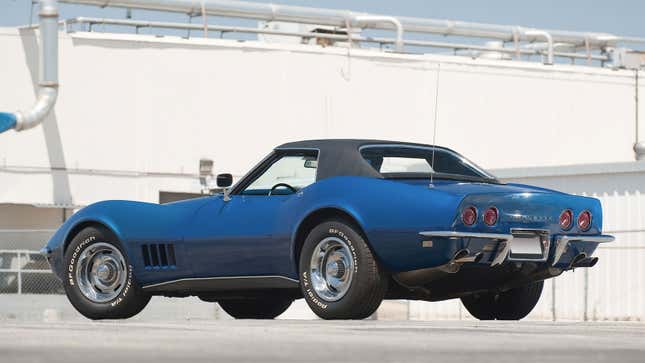 A photo of the rear end of a blue Corvette C3. 