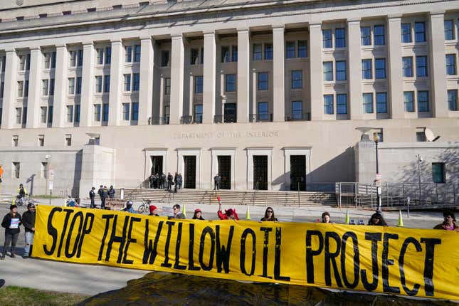 FILE - Demonstrators protest against the Biden administration&#39;s approval of the Willow oil-drilling project before a scheduled speech by Biden at the Department of the Interior in Washington, March 21, 2023. A federal judge on Thursday, Nov. 9 upheld the Biden administration&#39;s approval of the Willow oil-drilling project on Alaska&#39;s remote North Slope, a massive project that had drawn the ire of environmentalists who accused the president of backpedaling on his pledge to combat climate change. (AP Photo/Patrick Semansky, File)