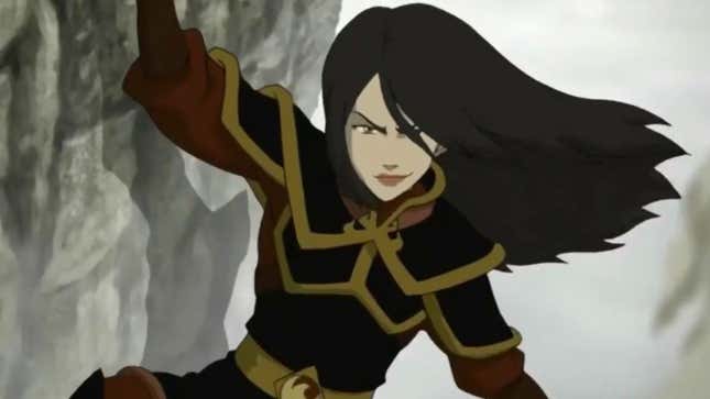 A smug Azula, in her Fire Nation warrior outfit, hangs precariously on the side of a rock cliff.