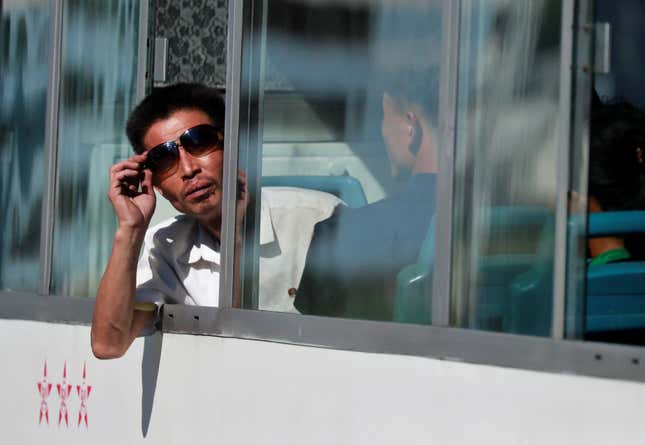 A man on a bus in Pyongyang.