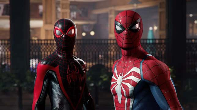 Miles Morales and Peter Parker look into the camera while wearing their Spider-Man suits.