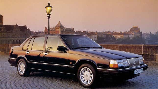 A photo of a black Volvo 940 sedan. 