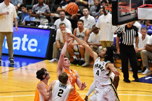 Nov 21, 2023; Honolulu, HI, USA; Tennessee Volunteers guard Dalton Knecht (3) attempts a shot defended by Purdue Boilermakers forward Trey Kaufman-Renn (4) during the first period at SimpliFi Arena at Stan Sheriff Center.