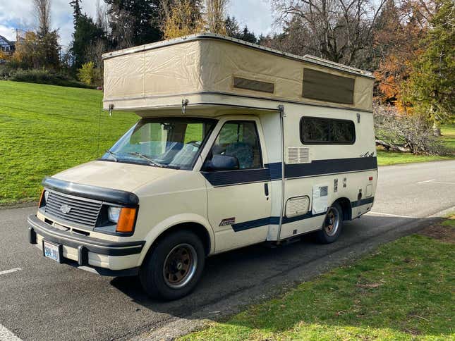 a photo of the astro van with the pop top open