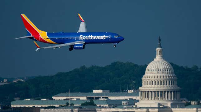 A Southwest Airlines Boeing 737-800 jet flies past the U.S. Capitol dome as it comes in for a landing at Ronald Reagan Washington National Airport on Tuesday, May 7, 2024.