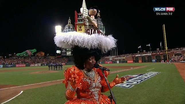 Here Is A Terrible Performance Of "God Bless America" By A Woman Wearing The City Of San Francisco On Her Head