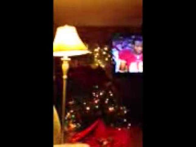 Elated Redskins Fan Tackling A Christmas Tree? Elated Redskins Fan Tackling A Christmas Tree