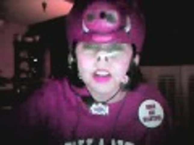 Here's An Arkansas Fan Wearing A Bizarre Hog Costume Singing Her Own Razorbacks Version Of "United We Stand"