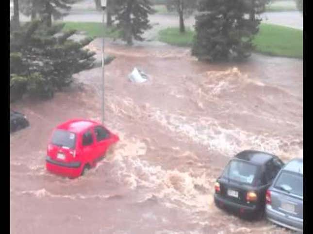 A flash flood swallows an entire parking lot in Australia