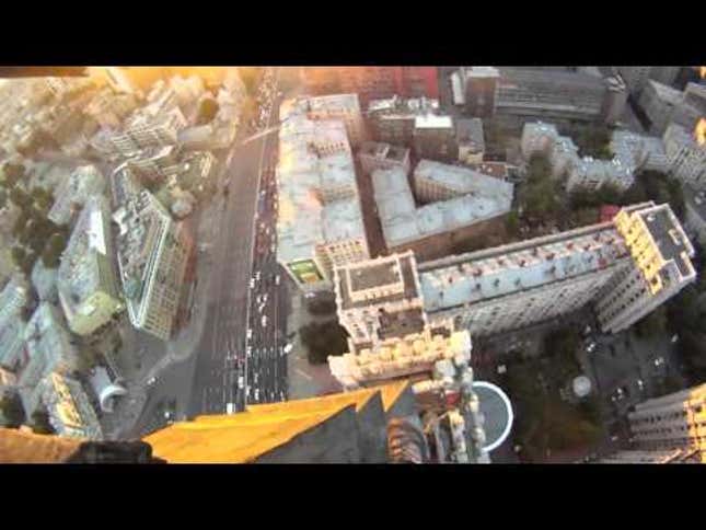 Watch a Ballsy Guy Climb Up Stalin's Skyscraper Without Any Safety Gear