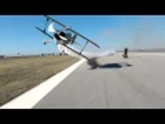 Watch A Biplane Nearly Decapitate Two People