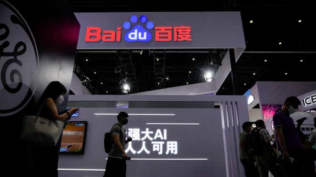 People stand by a sign of Baidu during World Artificial Intelligence Conference, following the coronavirus disease (COVID-19) outbreak, in Shanghai, China, September 1, 2022. 