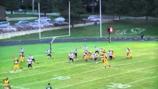 High School QB Makes Ridiculous Falling-Down-Behind-The-Back TD Pass