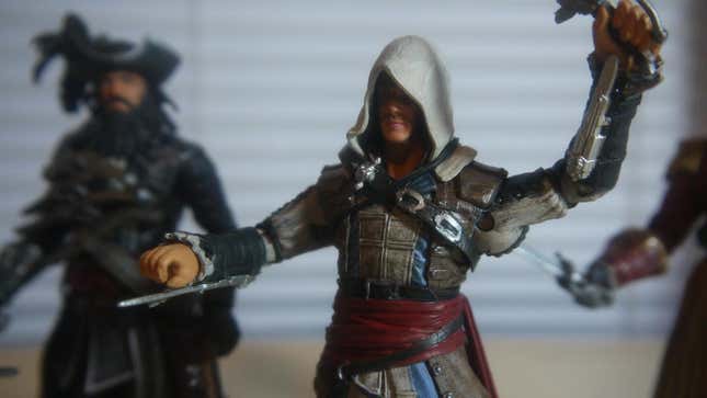 I'm Playing <em>Assassin's Creed IV</em> Right Now. On My Desk. With Toys.