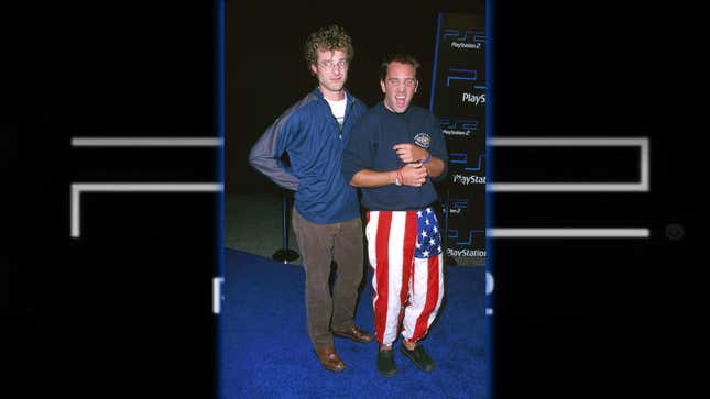 Matt Stone and Trey Parker stand on the PS2 blue carpet. 