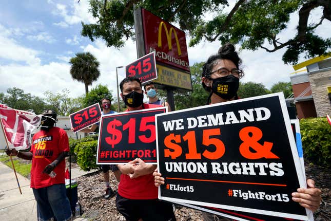 FILE - Workers and family members take part in a 15-city walkout to demand $15 per hour wages on May 19, 2021, in front of a McDonald&#39;s restaurant in Sanford, Fla. A federal rule that goes into effect next month could make it easier for millions of workers to form unions at big companies like McDonald&#39;s. But it&#39;s already facing significant pushback from businesses and some members of Congress. (AP Photo/John Raoux, File)