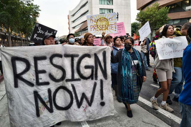 Comunidades Indígenas en Liderazgo (CIELO) and leaders from Indigenous communities across California hold signs during a demonstration demanding the resignations of L.A. City Councilmen Kevin de León and Gil Cedillo for their participation in a leaked discussion that included racial slurs on Saturday, Oct. 15, 2022.