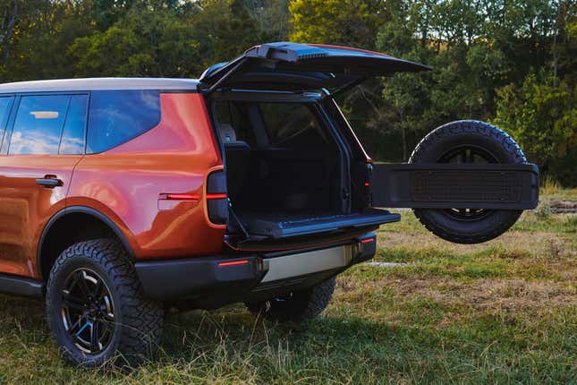 An orange Scout Traveler with its tailgate open