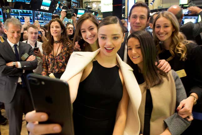 Model Miranda Kerr, fiancée of Snap CEO Evan Spiegel, takes a snap from the trading floor of the New York Stock Exchange as Snap prepares to trade.